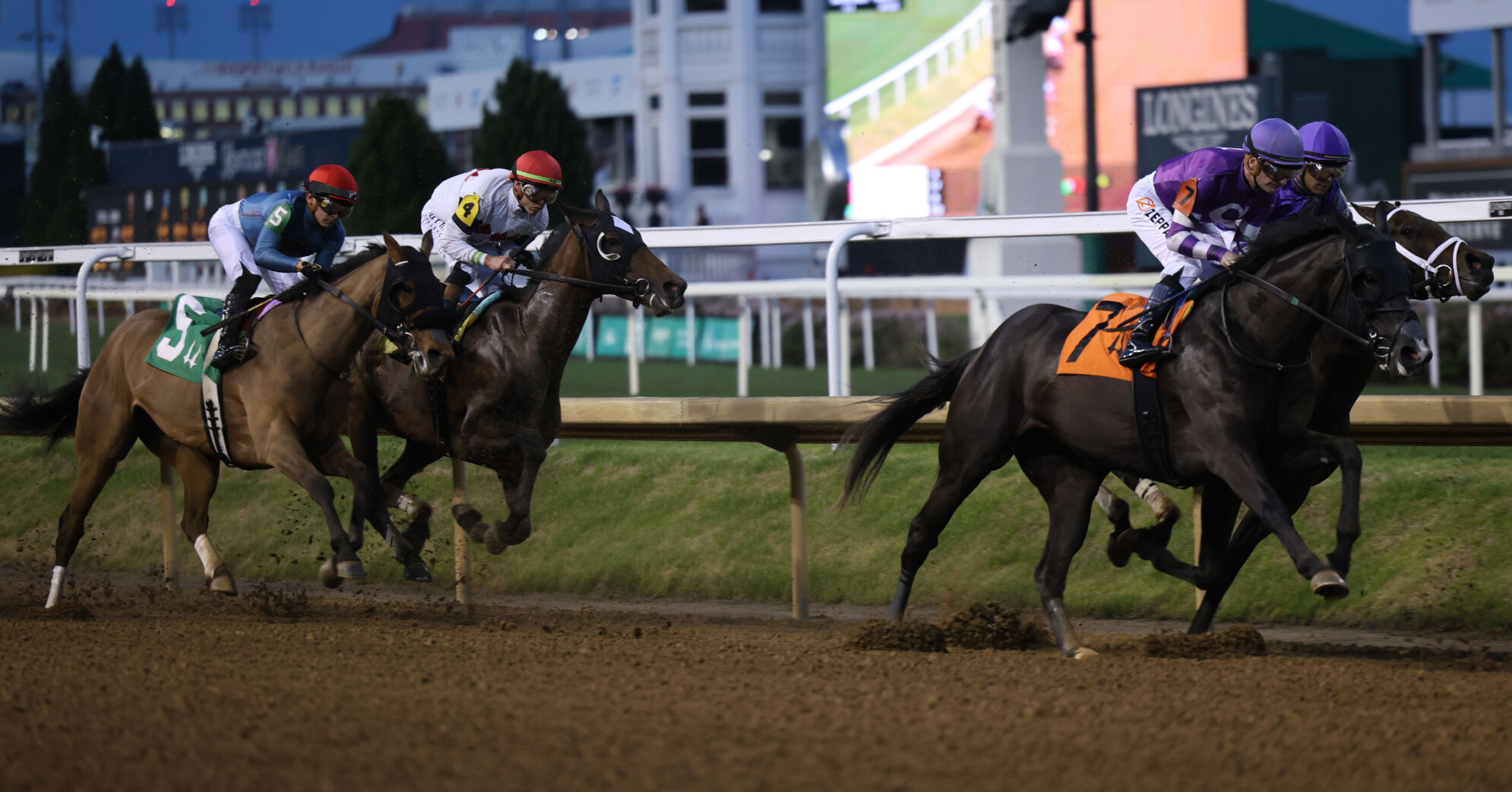 Horses and jockeys run at Opening Night.JPG
